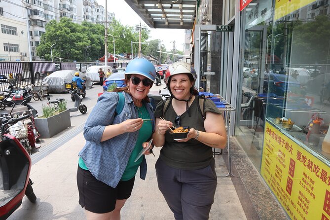 Street Food in Beijing Hutongs by Bike - Riding details: e-bike help, helmet included